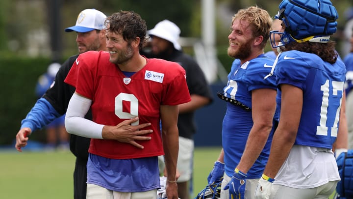 Aug 1, 2024; Los Angeles, CA, USA;  Los Angeles Rams quarterback Matthew Stafford (9) and wide receiver Cooper Kupp (10) and wide receiver Puka Nacua (17) smile during training camp at Loyola Marymount University. Mandatory Credit: Kiyoshi Mio-USA TODAY Sports