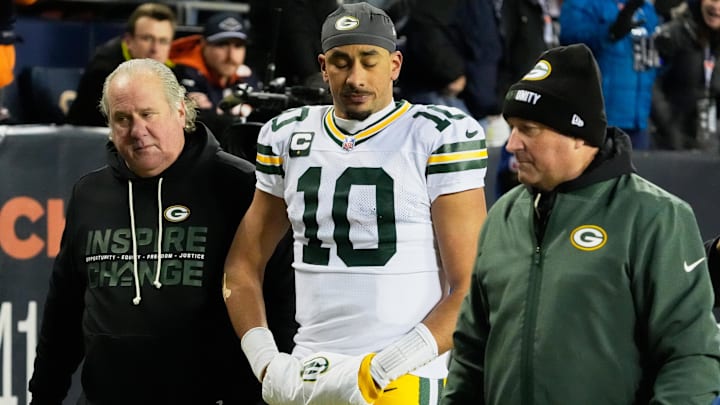Dec 20, 2025; Chicago, Illinois, USA; Green Bay Packers quarterback Jordan Love (10) walks off the field with an apparent injury against the Chicago Bears during the second quarter at Soldier Field.