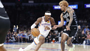 Oct 30, 2024; Oklahoma City, Oklahoma, USA; Oklahoma City Thunder guard Shai Gilgeous-Alexander (2) drives to the basket against San Antonio Spurs forward Jeremy Sochan (10) during the second half at Paycom Center. Mandatory Credit: Alonzo Adams-Imagn Images