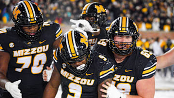 Nov 30, 2024; Columbia, Missouri, USA; Missouri Tigers running back Marcus Carroll (9) celebrates after scoring against the Arkansas Razorbacks during the second half at Faurot Field at Memorial Stadium. Mandatory Credit: Denny Medley-Imagn Images