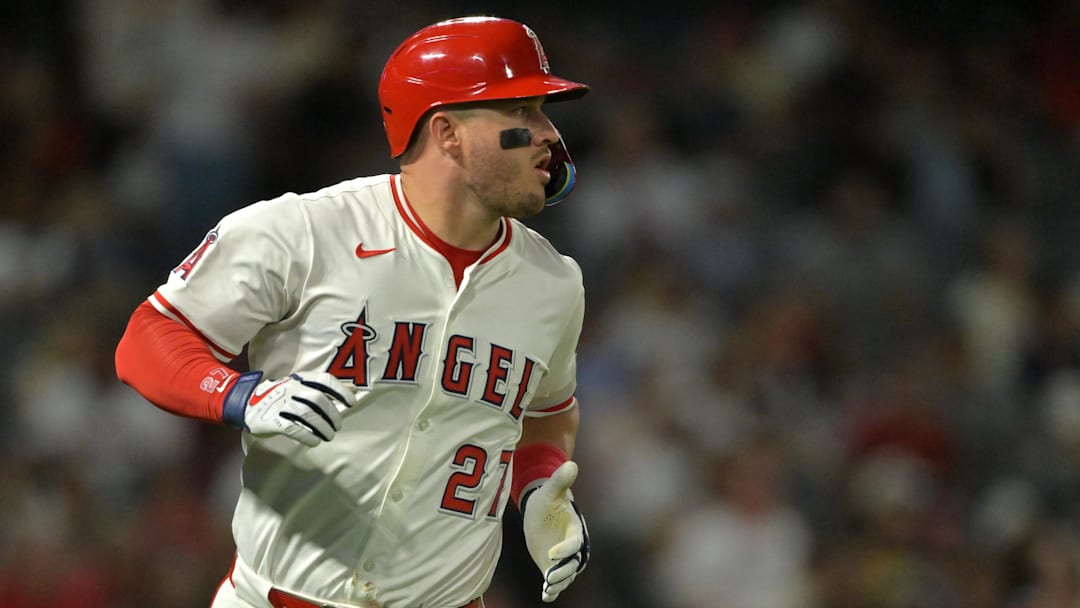 Sep 23, 2025; Anaheim, California, USA;  Los Angeles Angels designated hitter Mike Trout (27) runs to first on a fly out in the fourth inning against the Kansas City Royals at Angel Stadium. Mandatory Credit: Jayne Kamin-Oncea-Imagn Images