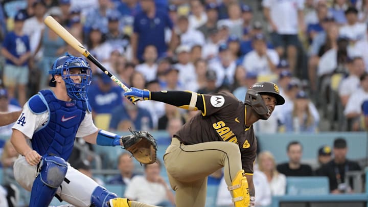Oct 11, 2024; Los Angeles, California, USA; San Diego Padres outfielder Jurickson Profar (10) reacts at bat in the fourth inning against the Los Angeles Dodgers during game five of the NLDS for the 2024 MLB Playoffs at Dodger Stadium. Mandatory Credit: Jayne Kamin-Oncea-Imagn Images
