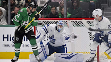 Dec 18, 2024; Dallas, Texas, USA; Toronto Maple Leafs goaltender Joseph Woll (60) makes a glove save as Dallas Stars left wing Jamie Benn (14) looks on during the third period at the American Airlines Center. Mandatory Credit: Jerome Miron-Imagn Images