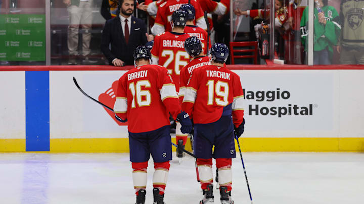 Oct 8, 2024; Sunrise, Florida, USA; Florida Panthers center Aleksander Barkov (16) and left wing Matthew Tkachuk (19) exit the ice after the game against the Boston Bruins at Amerant Bank Arena. Mandatory Credit: Sam Navarro-Imagn Images