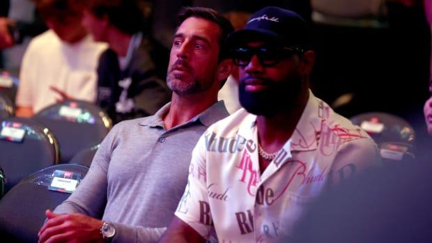 Aaron Rodgers and his friend and former teammate Marcedes Lewis, the current Bears tight end, take in a UFC fight in Vegas. 