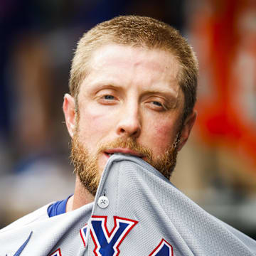 Aug 2, 2025; Seattle, Washington, USA; Texas Rangers starting pitcher Merrill Kelly (23) walks in the dugout after being relieved for against the Seattle Mariners during the sixth inning at T-Mobile Park. Mandatory Credit: Joe Nicholson-Imagn Images
