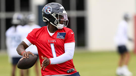 May 10, 2025; Nashville, TN, USA;  Tennessee Titans quarterback Cam Ward (1) throws a pass as he goes through drills during Rookie Mini Camp at Saint Thomas Sports Park. Mandatory Credit: Steve Roberts-Imagn Images