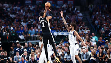 Oct 22, 2025; Dallas, TX; Victor Wembanyama shoots over Dallas Mavericks center Dereck Lively II during the first quarter  at American Airlines Center