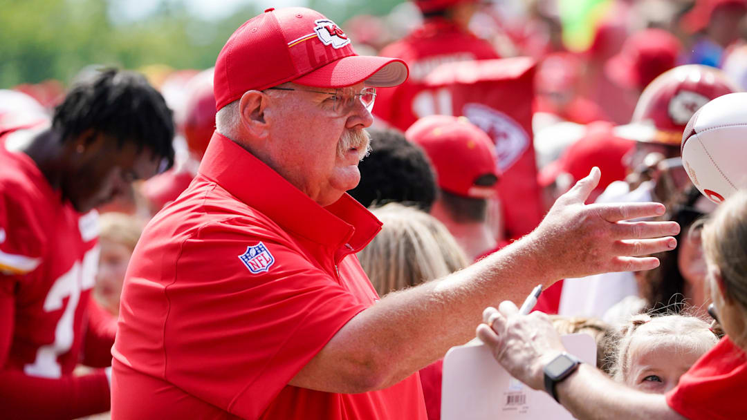 Jul 24, 2023; St. Joseph, MO, USA; Kansas City Chiefs head coach Andy Reid signs autographs for fans during training camp at Missouri Western State University. Mandatory Credit: Denny Medley-Imagn Images