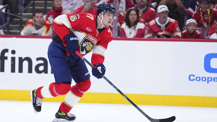 Apr 28, 2025; Sunrise, Florida, USA; Florida Panthers defenseman Niko Mikkola (77) controls the puck against the Tampa Bay Lightning during the first period in game four of the first round of the 2025 Stanley Cup Playoffs at Amerant Bank Arena. Mandatory Credit: Rich Storry-Imagn Images Apr 28, 2025; Sunrise, Florida, USA; Florida Panthers defenseman Niko Mikkola (77) controls the puck against the Tampa Bay Lightning during the first period in game four of the first round of the 2025 Stanley Cup Playoffs at Amerant Bank Arena. Mandatory Credit: Rich Storry-Imagn Images