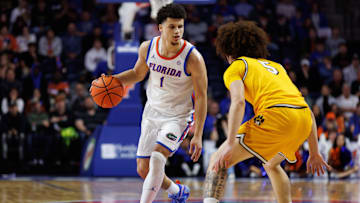 Jan 14, 2025; Gainesville, Florida, USA; Florida Gators guard Walter Clayton Jr. (1) dribbles the ball at Missouri Tigers guard T.O. Barrett (5) during the second half at Exactech Arena at the Stephen C. O'Connell Center. Mandatory Credit: Matt Pendleton-Imagn Images