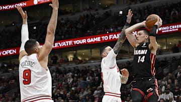 Feb 4, 2025; Chicago, Illinois, USA;  Miami Heat guard Tyler Herro (14)  passes the ball away