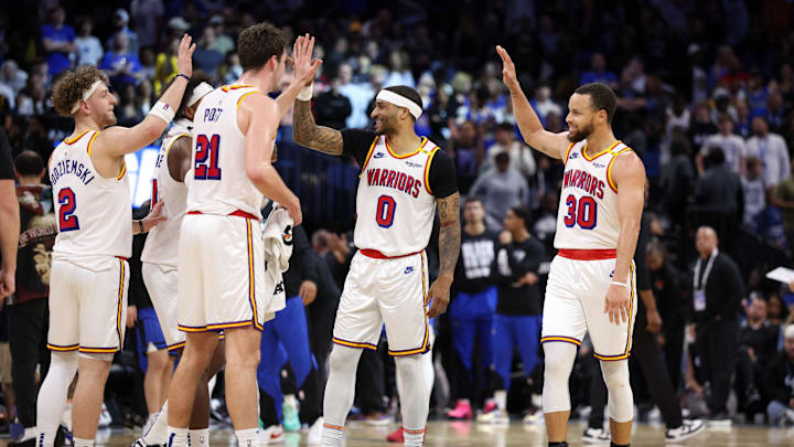 Feb 27, 2025; Orlando, Florida, USA; Golden State Warriors guard Stephen Curry (30) celebrates with guard Gary Payton II (0) center Quinten Post (21) after a play against the Orlando Magic in the fourth quarter at Kia Center. Mandatory Credit: Nathan Ray Seebeck-Imagn Images