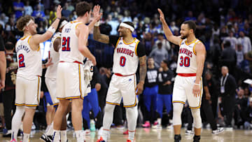 Feb 27, 2025; Orlando, Florida, USA; Golden State Warriors guard Stephen Curry (30) celebrates with guard Gary Payton II (0) center Quinten Post (21) after a play against the Orlando Magic in the fourth quarter at Kia Center. Mandatory Credit: Nathan Ray Seebeck-Imagn Images