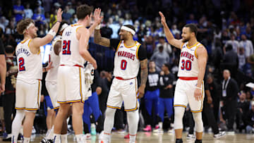 Feb 27, 2025; Orlando, Florida, USA; Golden State Warriors guard Stephen Curry (30) celebrates with guard Gary Payton II (0) center Quinten Post (21) after a play against the Orlando Magic in the fourth quarter at Kia Center. Mandatory Credit: Nathan Ray Seebeck-Imagn Images