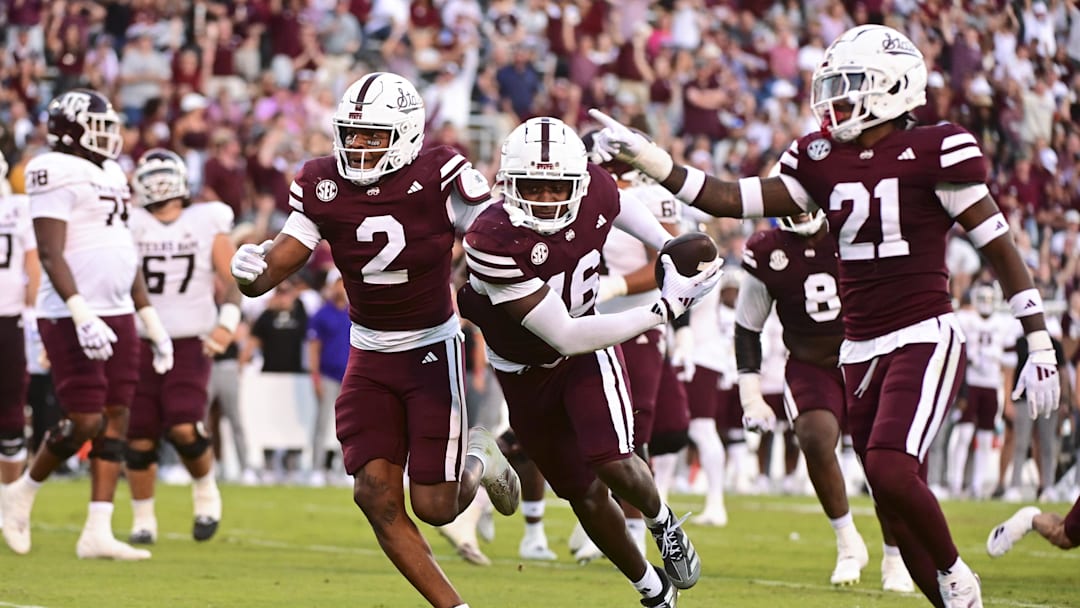 Oct 19, 2024; Starkville, Mississippi, USA; Mississippi State Bulldogs linebacker Zakari Tillman (16) reacts with teammates after an interception against the Texas A&M Aggies during the fourth quarter at Davis Wade Stadium at Scott Field. Mandatory Credit: Matt Bush-Imagn Images