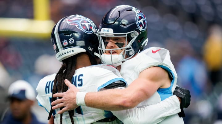 Tennessee Titans quarterback Will Levis (8) hugs wide receiver DeAndre Hopkins (10) before a game against the Houston Texans at NRG Stadium in Houston, Texas., Sunday, Dec. 31, 2023