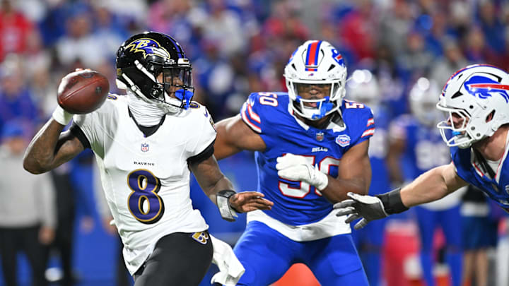 Sep 7, 2025; Orchard Park, New York, USA;  Baltimore Ravens quarterback Lamar Jackson (8) runs the ball during the fourth quarter against the Buffalo Bills at Highmark Stadium. Mandatory Credit: Mark Konezny-Imagn Images