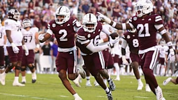 Oct 19, 2024; Starkville, Mississippi, USA; Mississippi State Bulldogs linebacker Zakari Tillman (16) reacts with teammates after an interception against the Texas A&M Aggies during the fourth quarter at Davis Wade Stadium at Scott Field. Mandatory Credit: Matt Bush-Imagn Images