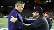 Portland, Oregon, USA; Montana State Bobcats head coach Brent Vigen (left) and Oregon State Beavers head coach Jonathan Smith (right) greet after the game at Providence Park.