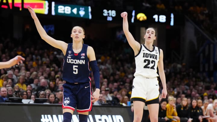 Apr 5, 2024; Cleveland, OH, USA; Iowa Hawkeyes guard Caitlin Clark (22) and Connecticut Huskies guard Paige Bueckers (5) in the second quarter in the semifinals of the Final Four of the women's 2024 NCAA Tournament at Rocket Mortgage FieldHouse.