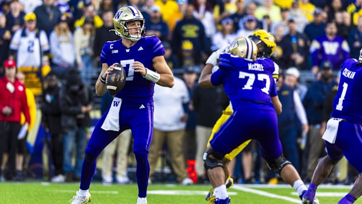 Oct 5, 2024; Seattle, Washington, USA; Washington Huskies quarterback Will Rogers (7) passes against the Michigan Wolverines during the first quarter at Alaska Airlines Field at Husky Stadium. Mandatory Credit: Joe Nicholson-Imagn Images
