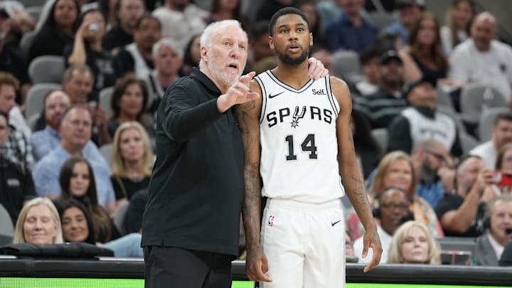 Mar 22, 2024; San Antonio, Texas, USA; San Antonio Spurs head coach Gregg Popovich talks with guard Blake Wesley (14) in the second half against the Memphis Grizzlies at Frost Bank Center.