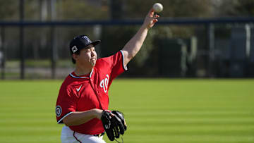 Feb 15, 2025; West Palm Beach, FL, USA; Washington Nationals pitcher Shinnosuke Ogasawara (16) warms up before Spring Training activities. 