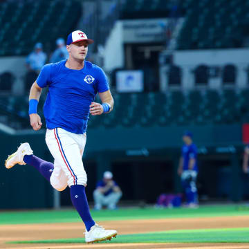 Jun 9, 2024; Arlington, Texas, USA; Texas Rangers injured third baseman Josh Jung runs before the game against the San Francisco Giants at Globe Life Field. 