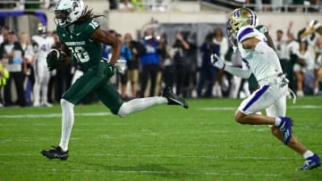 Sep 16, 2023; East Lansing, Michigan, USA;  Michigan State Spartans wide receiver Christian Fitzpatrick (16) runs upfield against Washington Huskies cornerback Darren Barkins (19) in the fourth quarter at Spartan Stadium. Mandatory Credit: Dale Young-USA TODAY Sports