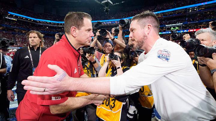 Oregon head coach Dan Lanning, right, and Indiana head coach Curt Cignetti shake hands as the Oregon Ducks face the Indiana Hoosiers in the Peach Bowl on Jan. 9, 2026, at Mercedes-Benz Stadium in Atlanta, Georgia.