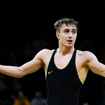 Iowa’s Drake Ayala reacts after defeating Oklahoma State's Rin Sakamoto in a 133-pound match Sunday, Feb. 23, 2025 at Carver-Hawkeye Arena in Iowa City, Iowa.