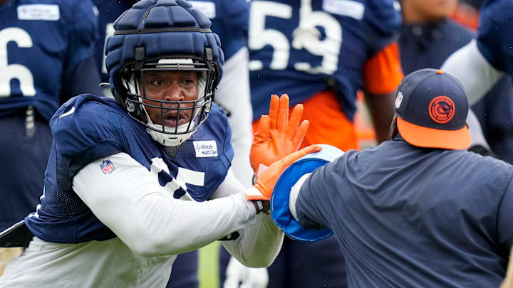 DeMarcus Walker goes through drills in Bears training camp. The defensive end sat out Wednesday's practice with a foot injury.