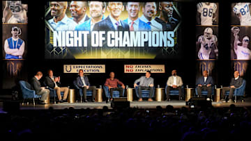 An audience watches broadcaster Jim Nantz (far left) moderate a discussion between former Indianapolis Colts (from left) center Jeff Saturday, quarterback Peyton Manning, wide receiver Marvin Harrison, tight end Dallas Clark, wide receiver Reggie Wayne, defensive end Dwight Freeney and coach Tony Dungy on Monday, Feb. 24, 2025, during the “Night of Champions” at the Murat Theatre at the Old National Centre. The event featured a panel discussion of players and coaches from the Indianapolis Colts.
