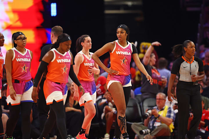 WNBA forward Angel Reese and Caitlin Clark react after a play during the first half of the WNBA All-Star Game. 