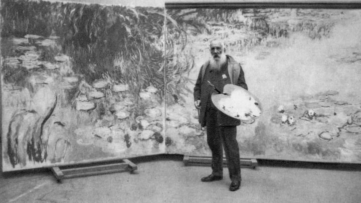 Claude Monet in his studio painting his Water Lilies series, 1923.