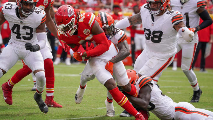 Aug 26, 2023; Kansas City, Missouri, USA; Kansas City Chiefs tight end Izaiah Gathings (42) is tackled by Cleveland Browns safety Tanner McCalister (48) during the second half at GEHA Field at Arrowhead Stadium. Mandatory Credit: Denny Medley-USA TODAY Sports