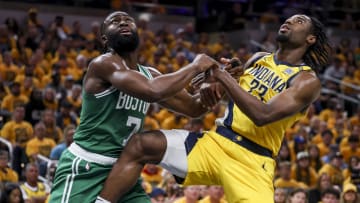 May 27, 2024; Indianapolis, Indiana, USA; Boston Celtics guard Jaylen Brown (7) and Indiana Pacers forward Aaron Nesmith (23) push each other away to intercept the ball during the second quarter during game four of the eastern conference finals for the 2024 NBA playoffs at Gainbridge Fieldhouse. Mandatory Credit: Trevor Ruszkowski-USA TODAY Sports