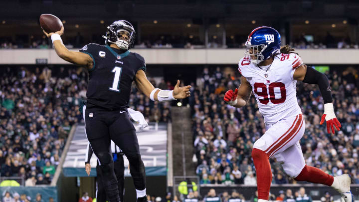 Jan 8, 2023; Philadelphia, Pennsylvania, USA; Philadelphia Eagles quarterback Jalen Hurts (1) passes the ball in front of New York Giants defensive end Ryder Anderson (90) during the third quarter at Lincoln Financial Field. Mandatory Credit: Bill Streicher-USA TODAY Sports