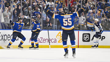 Apr 24, 2025; St. Louis, Missouri, USA; St. Louis Blues defenseman Cam Fowler (17) is congratulated by teammates after scoring against the Winnipeg Jets during the first period in game three of the first round of the 2025 Stanley Cup Playoffs at Enterprise Center. Mandatory Credit: Jeff Curry-Imagn Images