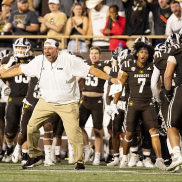 Sep 17, 2022; Kalamazoo, Michigan, USA; Western Michigan defensive coordinator Lou Esposito (middle) celebrates with Kyle Arnoldi (56) during a missed field goal attempt by the Pittsburgh Panthers in the second quarter at Waldo Stadium. Mandatory Credit: Kimberly Moss-USA TODAY Sports