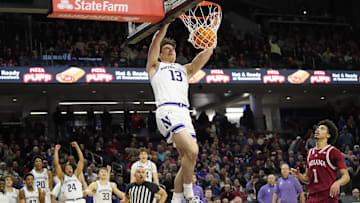 Jan 22, 2025; Evanston, Illinois, USA; Northwestern Wildcats guard Brooks Barnhizer (13) dunks the ball against the Indiana Hoosiers during the second half at Welsh-Ryan Arena. Mandatory Credit: David Banks-Imagn Images