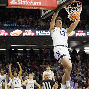 Jan 22, 2025; Evanston, Illinois, USA; Northwestern Wildcats guard Brooks Barnhizer (13) dunks the ball against the Indiana Hoosiers during the second half at Welsh-Ryan Arena. Mandatory Credit: David Banks-Imagn Images
