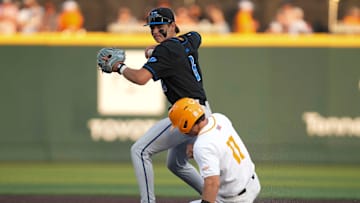 Kentucky infielder Tyler Bell (6) throws the ball to first base after getting Tennessee infielder Andrew Fischer (11) out at second base during a NCAA baseball game between Tennessee and Kentucky at Lindsey Nelson Stadium in Knoxville, Tenn., on April 18, 2025.