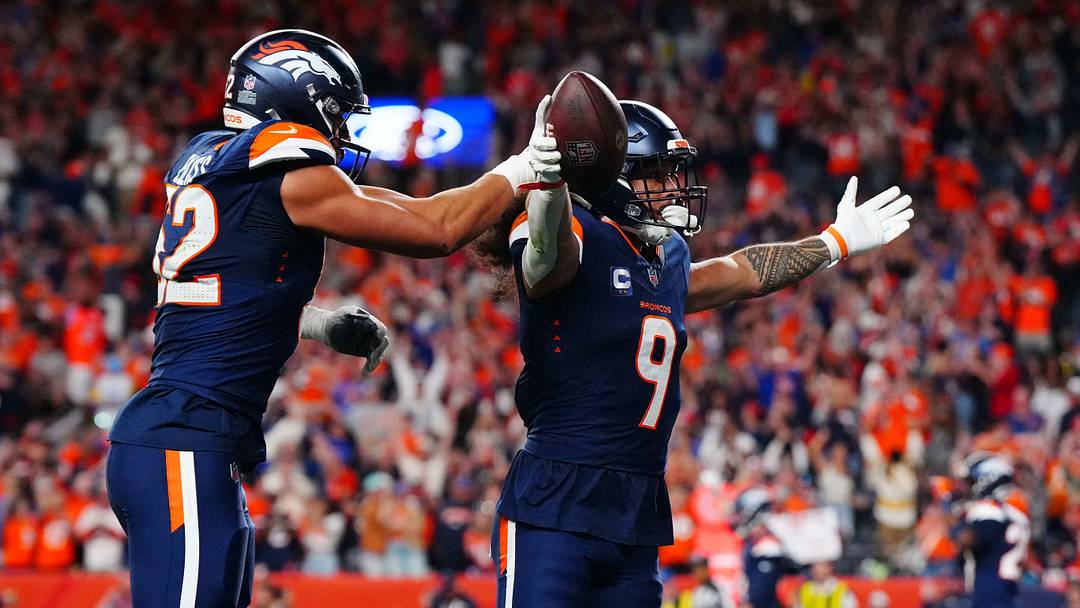 Sep 27, 2026; Denver, Colorado, USA;  Denver Broncos safety Talanoa Hufanga (9) celebrates after a game-winning interception against the Los Angeles Rams at Empower Field at Mile High.  Mandatory Credit: Ron Chenoy-Imagn Images