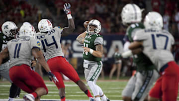 Sep 17, 2016; Tucson, AZ, USA; Hawaii Warriors quarterback Ikaika Woolsey (11) passes the ball against the Arizona Wildcats during the second quarter at Arizona Stadium. Mandatory Credit: Casey Sapio-Imagn Images