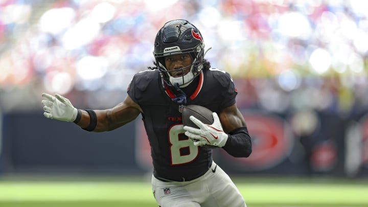 Aug 17, 2024; Houston, Texas, USA; Houston Texans wide receiver John Metchie III (8) runs with the ball after a reception during the second quarter against the New York Giants at NRG Stadium. 