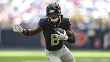 Aug 17, 2024; Houston, Texas, USA; Houston Texans wide receiver John Metchie III (8) runs with the ball after a reception during the second quarter against the New York Giants at NRG Stadium. Mandatory Credit: Troy Taormina-Imagn Images