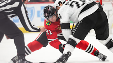 Mar 20, 2025; Chicago, Illinois, USA; Chicago Blackhawks center Frank Nazar (91) and Los Angeles Kings center Phillip Danault (24) face off during the second period at United Center. Mandatory Credit: Talia Sprague-Imagn Images