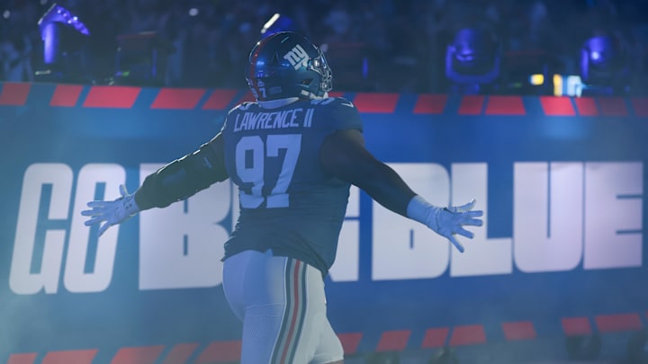 Oct 9, 2025; East Rutherford, New Jersey, USA; New York Giants defensive tackle Dexter Lawrence II (97) runs onto the field prior to the game against the Philadelphia Eagles at MetLife Stadium. Mandatory Credit: Vincent Carchietta-Imagn Images